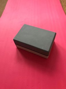 a yoga mat and block